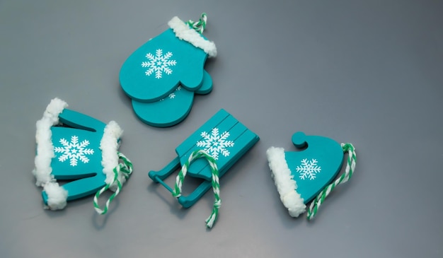 Wooden Christmas toys for the Christmas tree made by hand in turquoise color place for text new year gifts christmas home decoration for the holiday