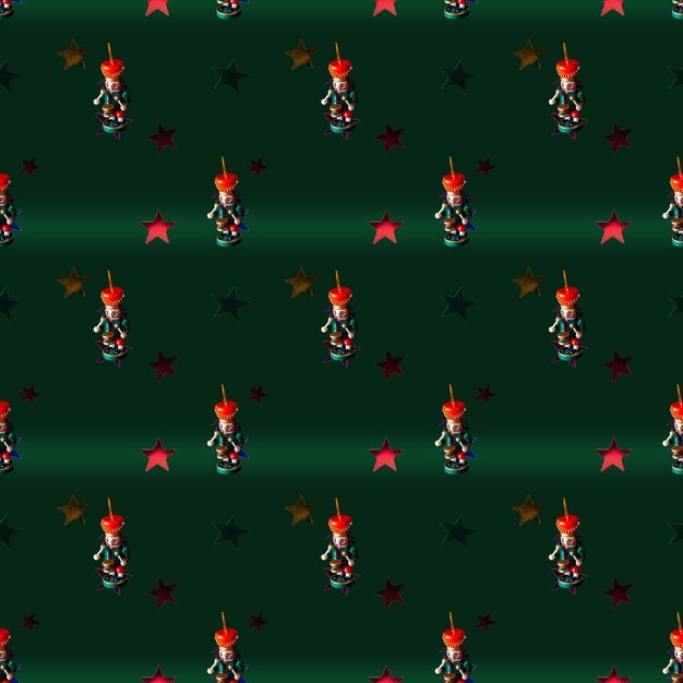 Photo wooden christmas toys and stars on green background seamless pattern