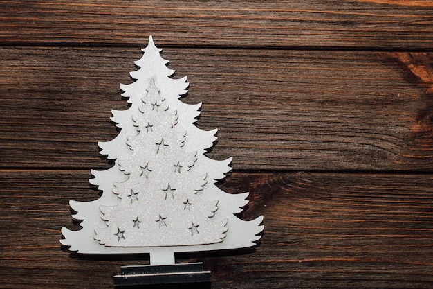 Wooden Christmas tree decoration on a wooden table background