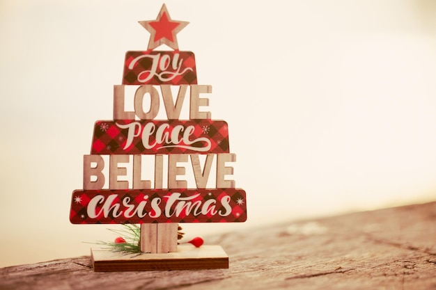 Wooden christmas tree toy on the beach