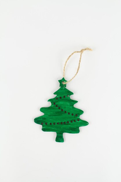 Wooden christmas tree toy on a white background