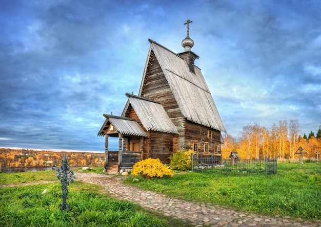 The Wooden Church of the Resurrection on Mount Levitan in Plyos and the blue sunset sky