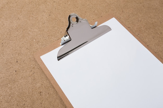 Wooden clipboard on wood background