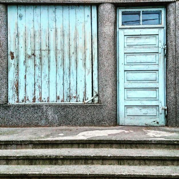 Photo wooden closed door and window of house