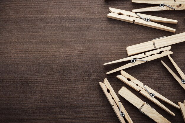 Premium Photo  Wooden clothes pins on the wooden surface