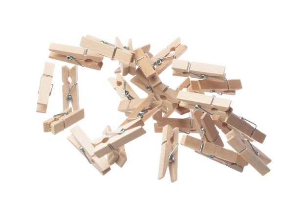 Wooden clothespins float gracefully in air purposeful clips and holds transformed into a dance of household order and creative inspiration Beige bundle of laundry dangles White background isolated