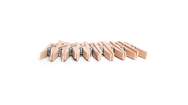 Photo wooden clothespins isolated on a white background. high quality photo