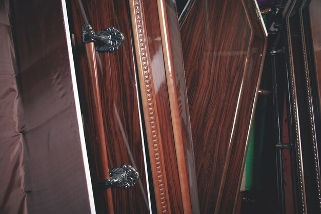 Wooden coffins in the dark room.