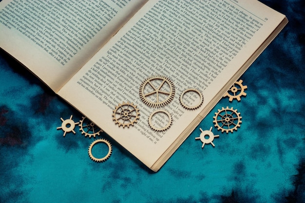 Wooden cogwheels on a page of a book Industry concept information