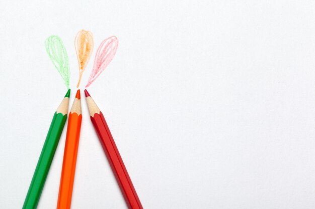 Wooden colorful ordinary pencils isolated on a white background