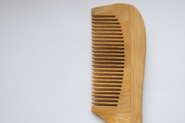 Wooden comb isolated on white background with clipping path.