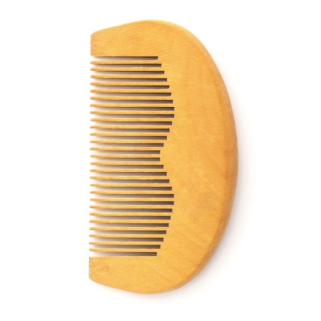 Wooden comb isolated on white. personal hygiene product