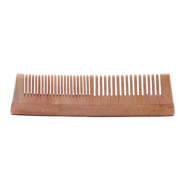 A wooden comb that has the word " on it " on it
