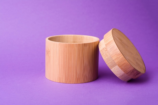 wooden container on purple background