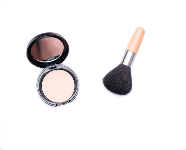 Wooden cosmetic brush and open box with face powder isolated