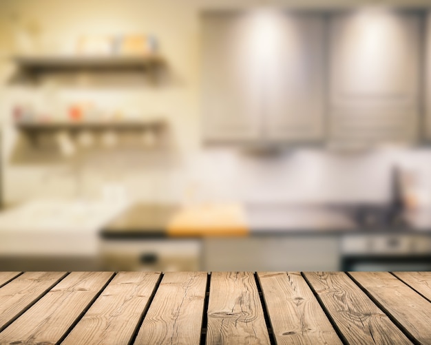 Wooden counter top with kitchen blurred background