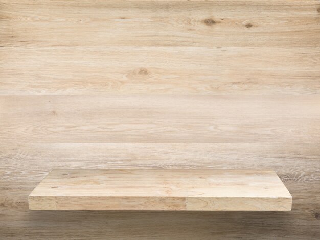 Wooden counter top with lamp and brick wall background