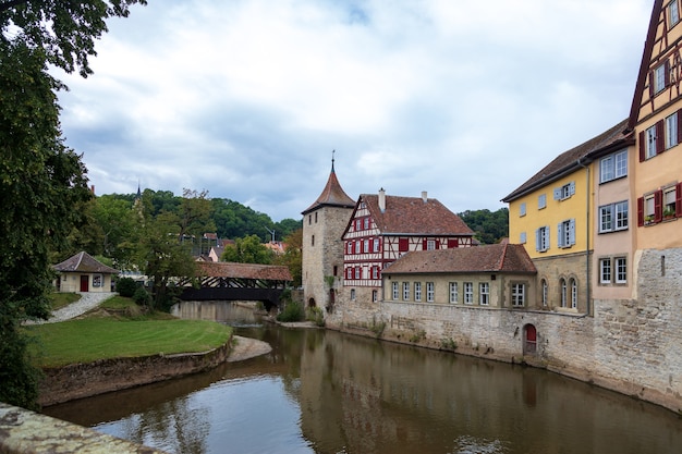 Wooden covered bridge and old tower in the historic center of
schw bisch hall on the kocher river, baden-wurttemberg, germany.
summer photo