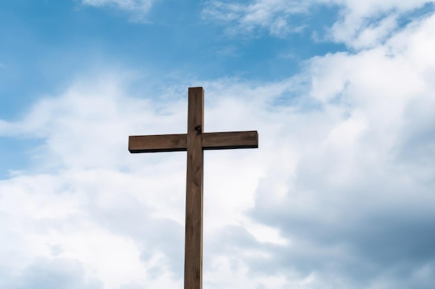 Wooden cross against a cloudy sky