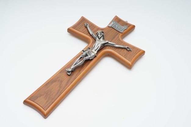 A wooden crucifix with the word jesus on it