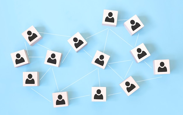 wooden cube block icon with link connection network and teamwork concept