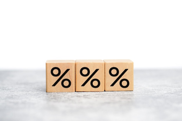 Wooden cube block increasing on top with icon percentage symbol, discount.