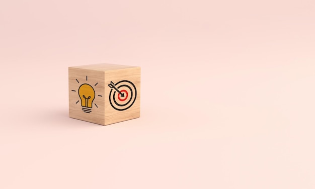 Wooden cube block with icon target and light bulb on pink background Concept of business strategy 3D illustration