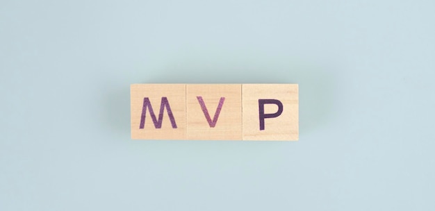 Wooden cube with the letter from the mvp word back and bang. wooden cubes standing