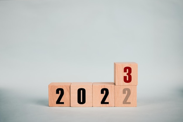 Wooden cubes 2022 and 2023 concept business change to new success