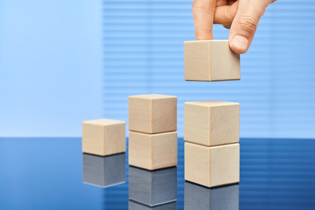 Wooden cubes on a blue background