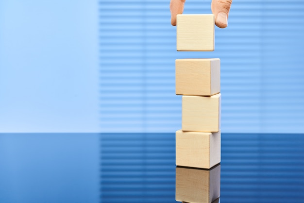 Wooden cubes on a blue background