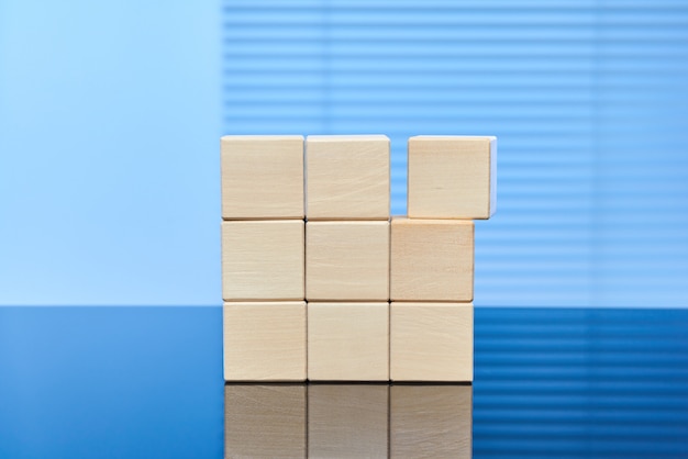Wooden cubes on a blue background