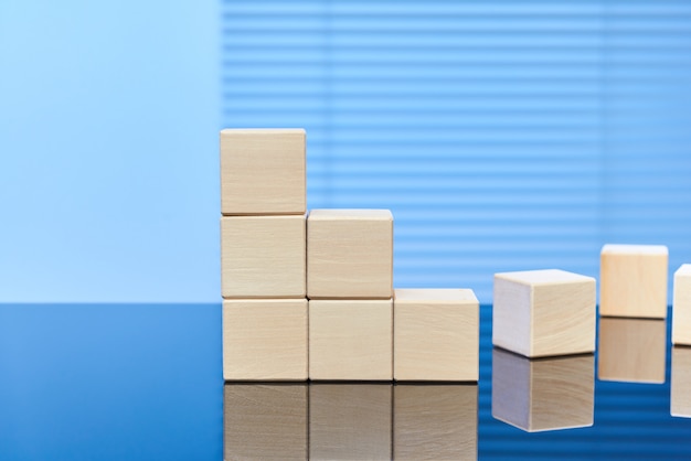 Wooden cubes on a blue background