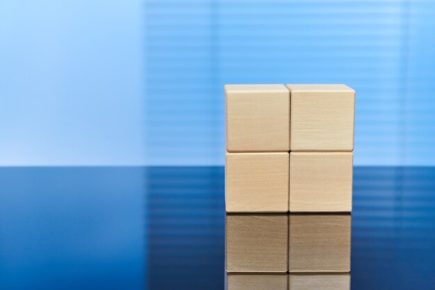 Wooden cubes on a blue background