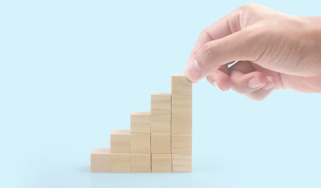 Wooden cubes in hand with copy space for input wording