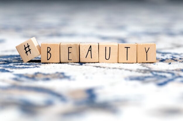 Photo wooden cubes with a hashtag and the word beauty, social media concept background