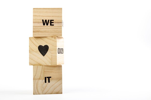 Wooden cubes with the inscription me love it on a white background