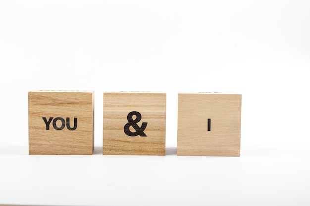 Wooden cubes with the inscription you i on a white background