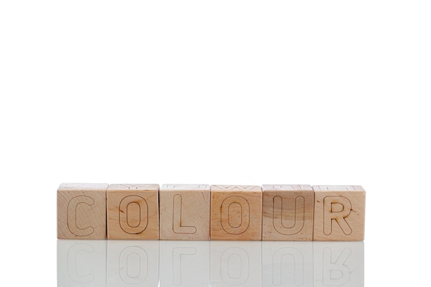 Wooden cubes with letters colour on a white background