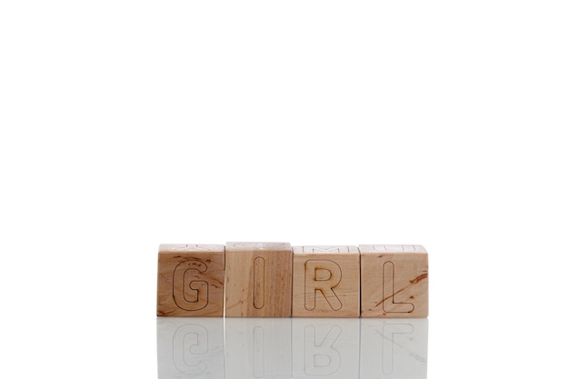 Wooden cubes with letters girl on a white background