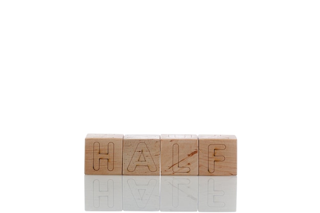 Wooden cubes with letters half on a white background