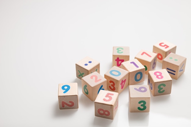 Wooden cubes with numbers on a white background as education and learning concept