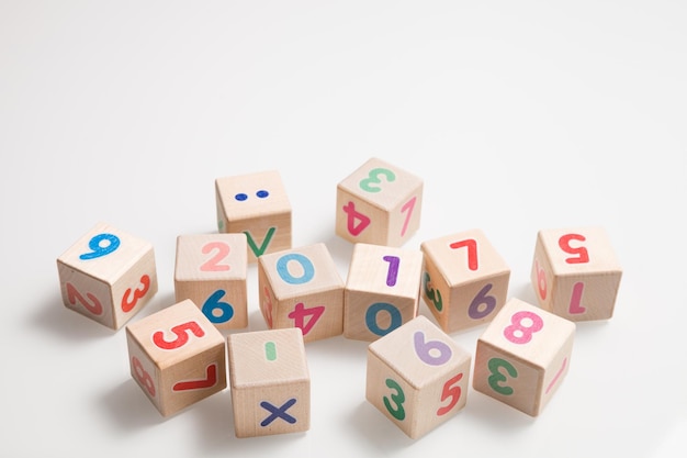 Wooden cubes with numbers on a white background education and\
learning concept