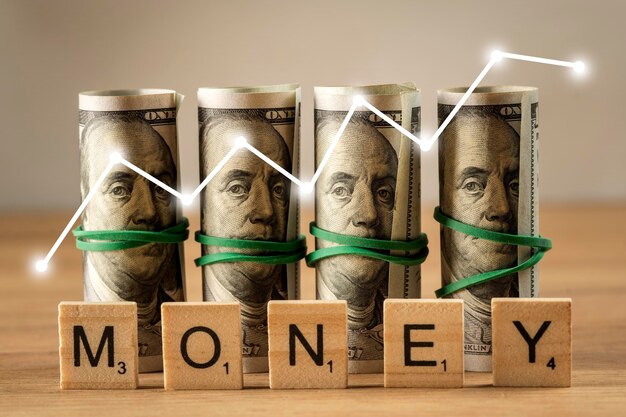 Wooden cubes on a wooden background with the inscription money concept business and success in finance The economic growth of finance Money work investment concept