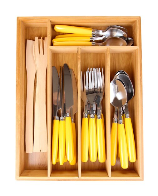 Wooden cutlery box with checked cutlery isolated on white