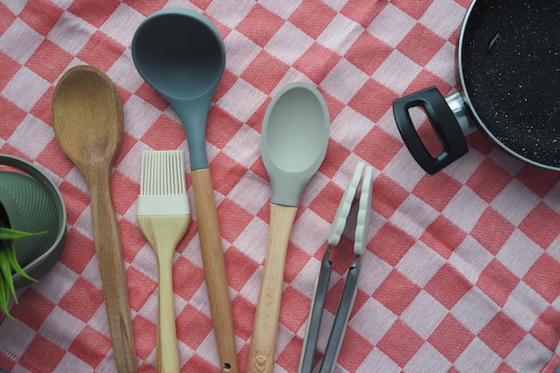 wooden cutlery fork and spoon on a chopping board on table