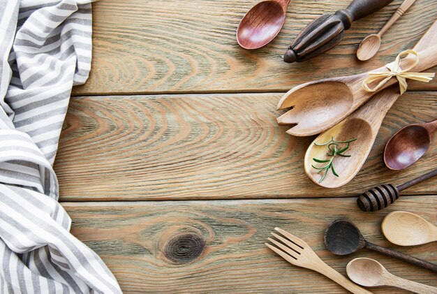 Wooden cutlery kitchenware on a old wooden surface