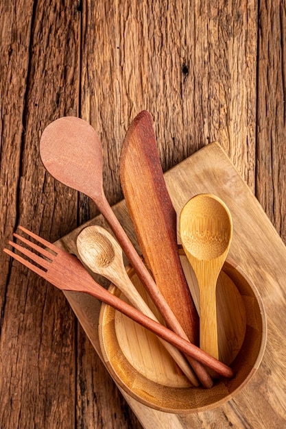 Wooden cutlery on wooden table