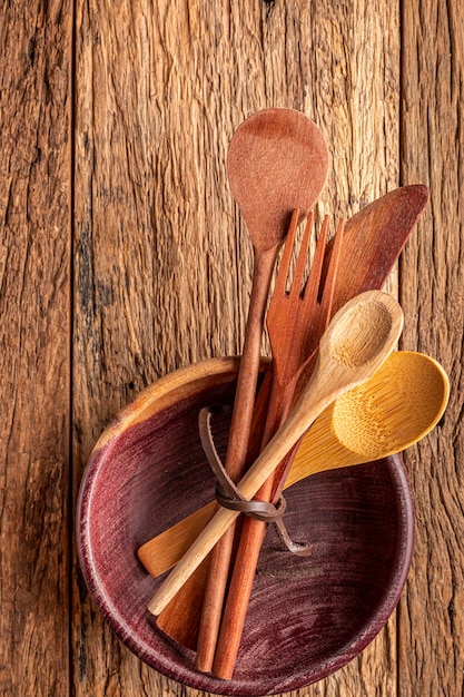 Wooden cutlery on wooden table