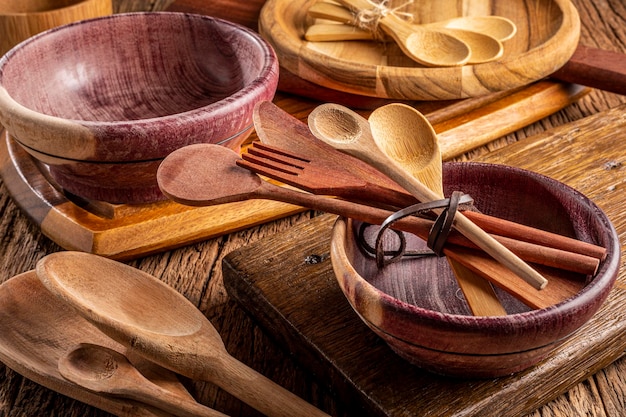 Wooden cutlery on wooden table